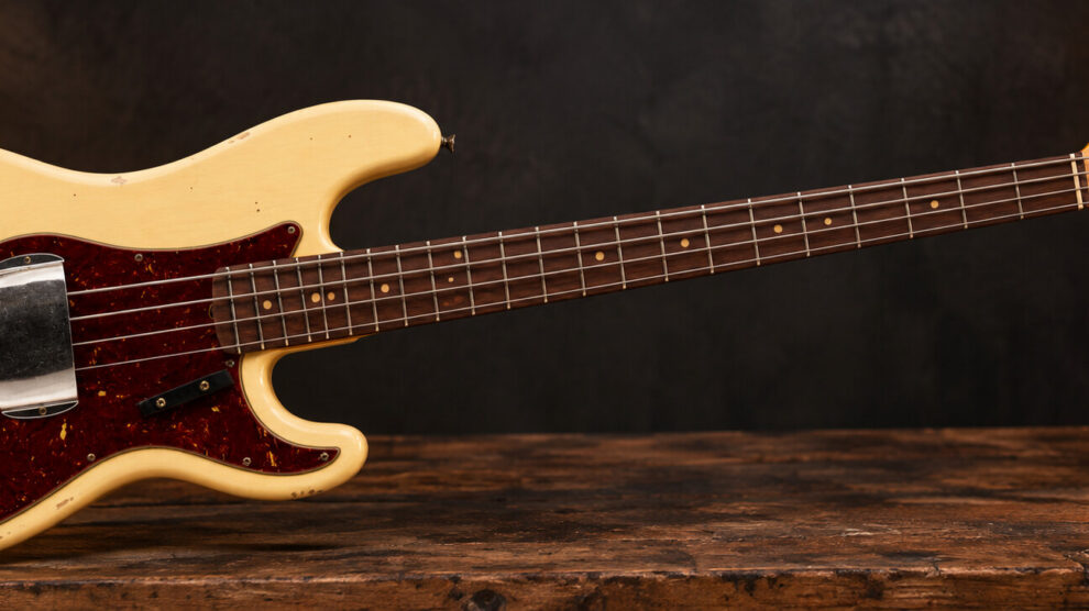 Vintage cream Fender Precision Bass prepared for a professional bass guitar setup in Nottingham