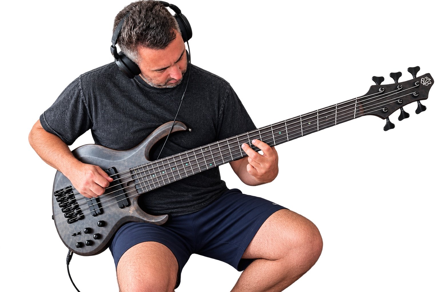 Rob Greco playing a six-string bass after setup and testing in Nottingham